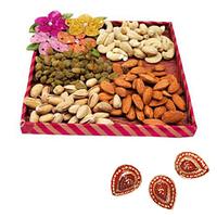 Dry-Fruits in a Tray with Diyas