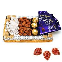 Tray with Chocolate, Dryfruits and Sweets with Diyas