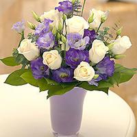 Cream and Purple Flowers in a Vase