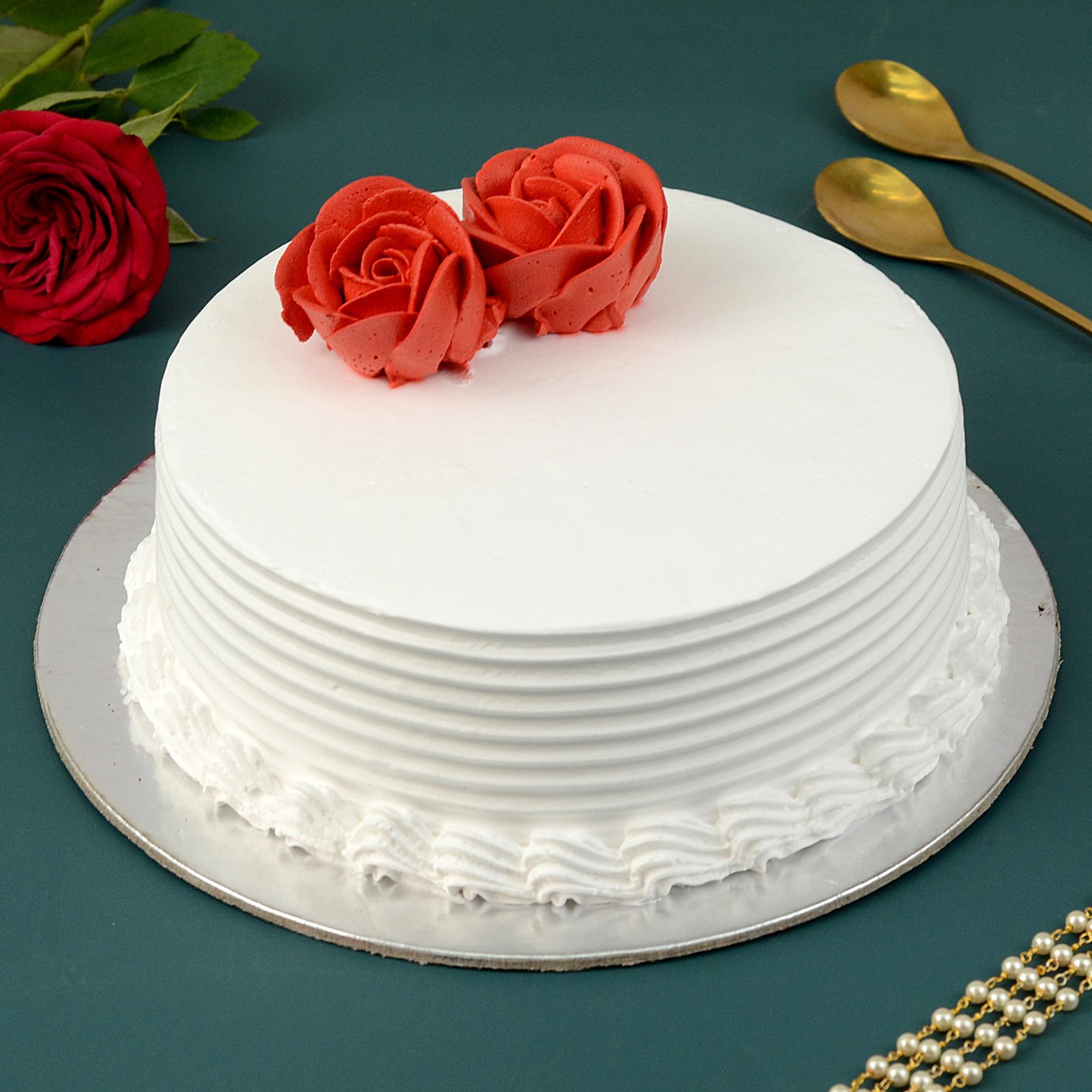 1 Kg Fresh And Delicious Vanilla Cake With Rose Flower Design For Party  Celebration Fat Contains (%): 18 Grams (g) at Best Price in Kolkata | The  Art Of Baking