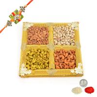 Tasty Dry Fruits in Yellow Thali with Rakhi