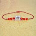 Stone with Beads Red Thread Rakhi
