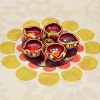 Red Diyas On Silver Colored Plate