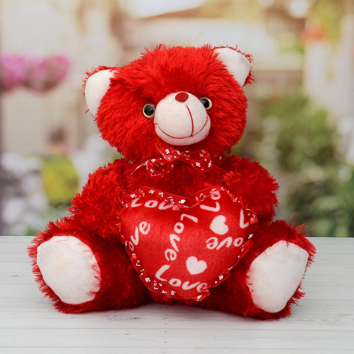 big teddy bear with red bow