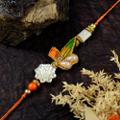 Orange and Blue With A Flower Rakhi