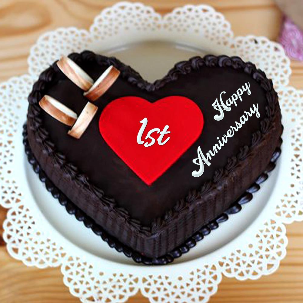 Premium Photo | Celebrating wedding anniversary with heart shape chocolate  cake.