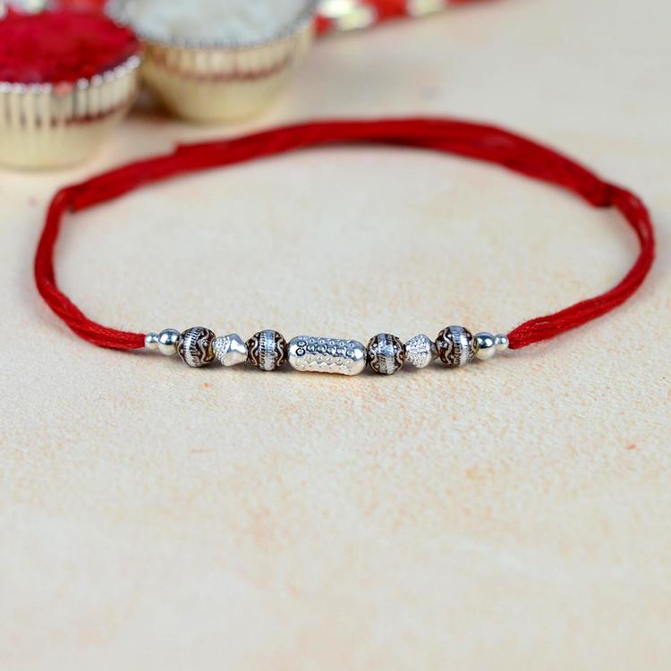 Tribal Art White Metal Rakhi