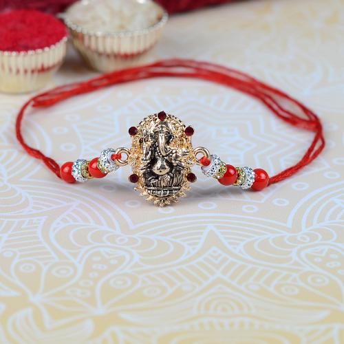 Antique Ganesh in Gold Rakhi