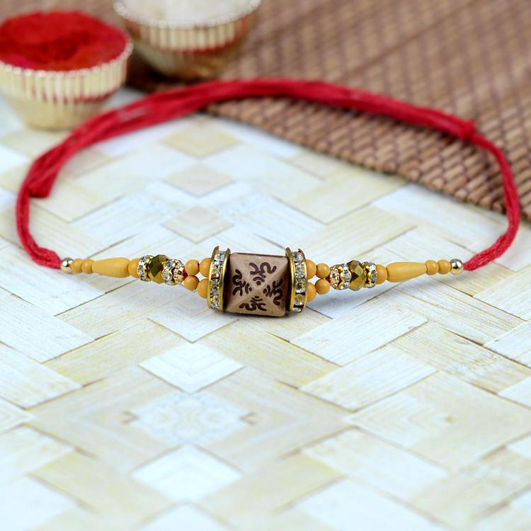 Wooden Pyramid Red Om Rakhi