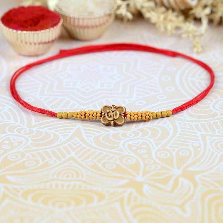 Delicate Om Rakhi AP23