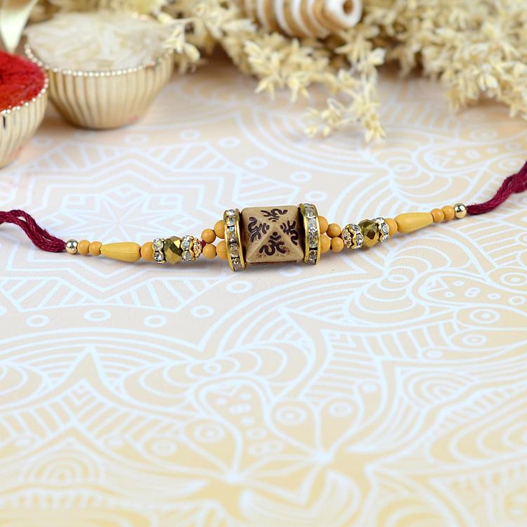 Wooden Pyramid Maroon Om Rakhi