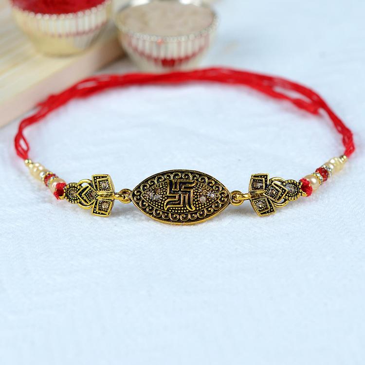 Antique Oval Swastik Rakhi