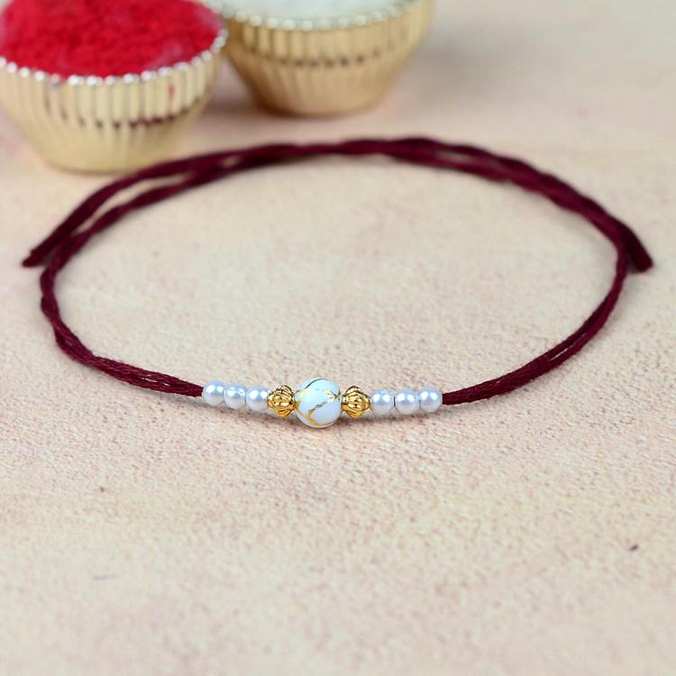 Gold Painted White Bead Rakhi VKP61 Maroon