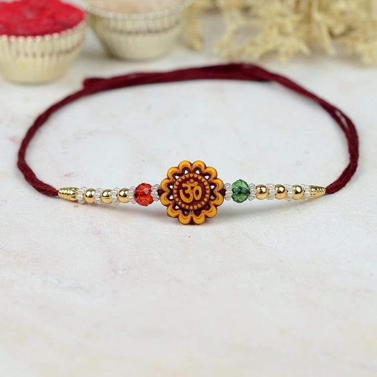 Floral Om 399 Rakhi Maroon Dori