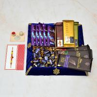 Set of 8 Temptation Rakhi Hamper in Blue Thali.