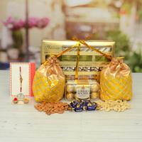 Sweets, Choclairs, Almonds with Rakhi.