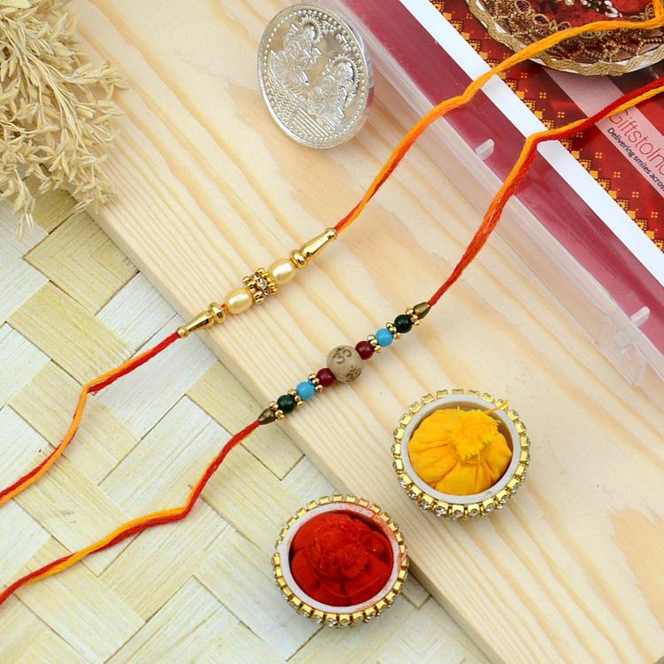 Intricate Pearl and Om Designed Rakhi Set