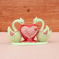Two Swans Holding Heart