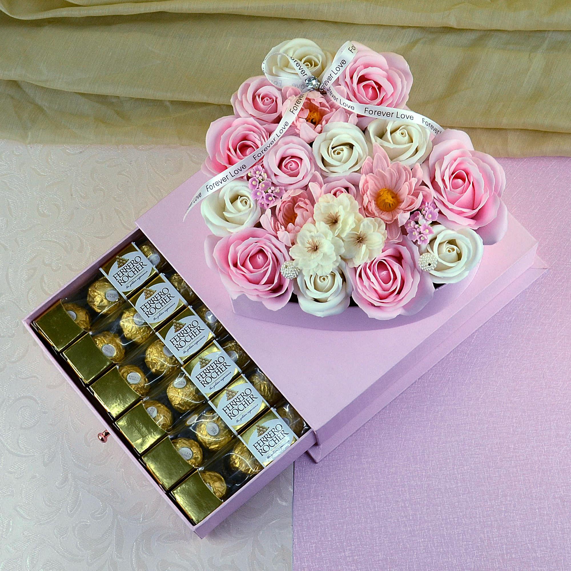 flowers in a box with chocolates