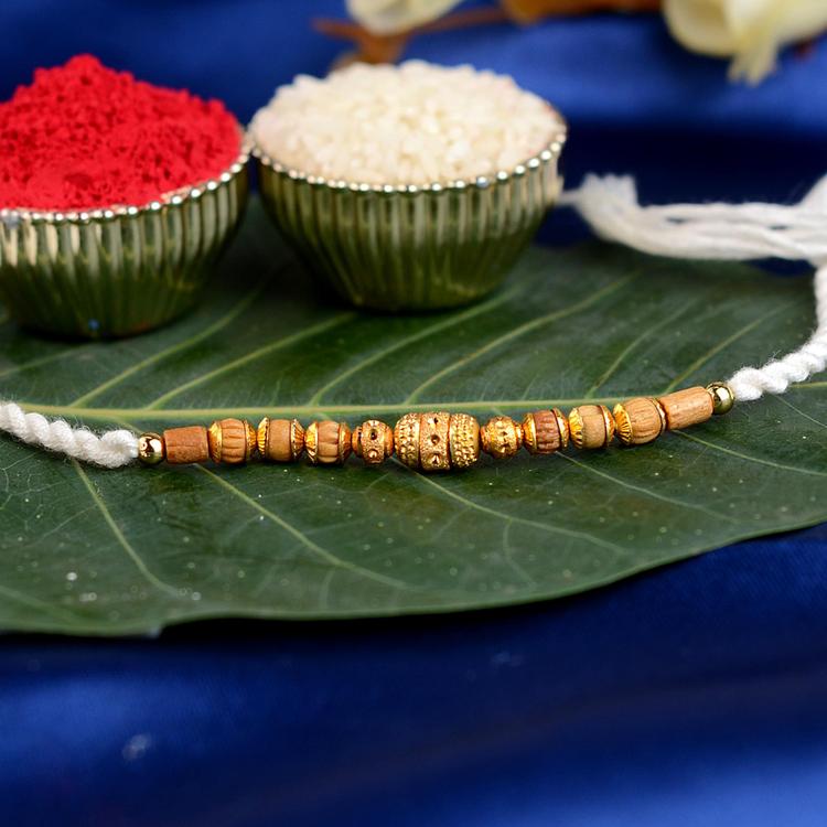 Ornate Gold Tulsi White Rakhi