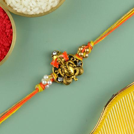 Ornate Orange Ganesh Rakhi