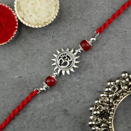 White Metal Om in Surya Rakhi