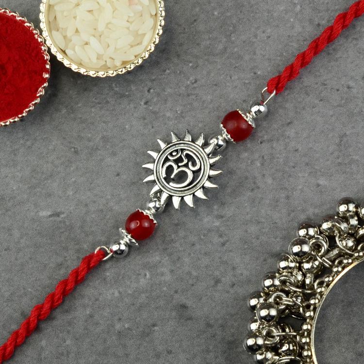 White Metal Om in Surya Rakhi 