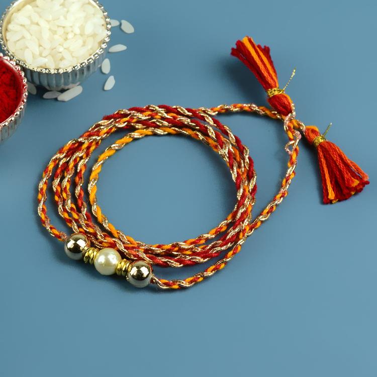 Stunning Single Pearl Dori Rakhi