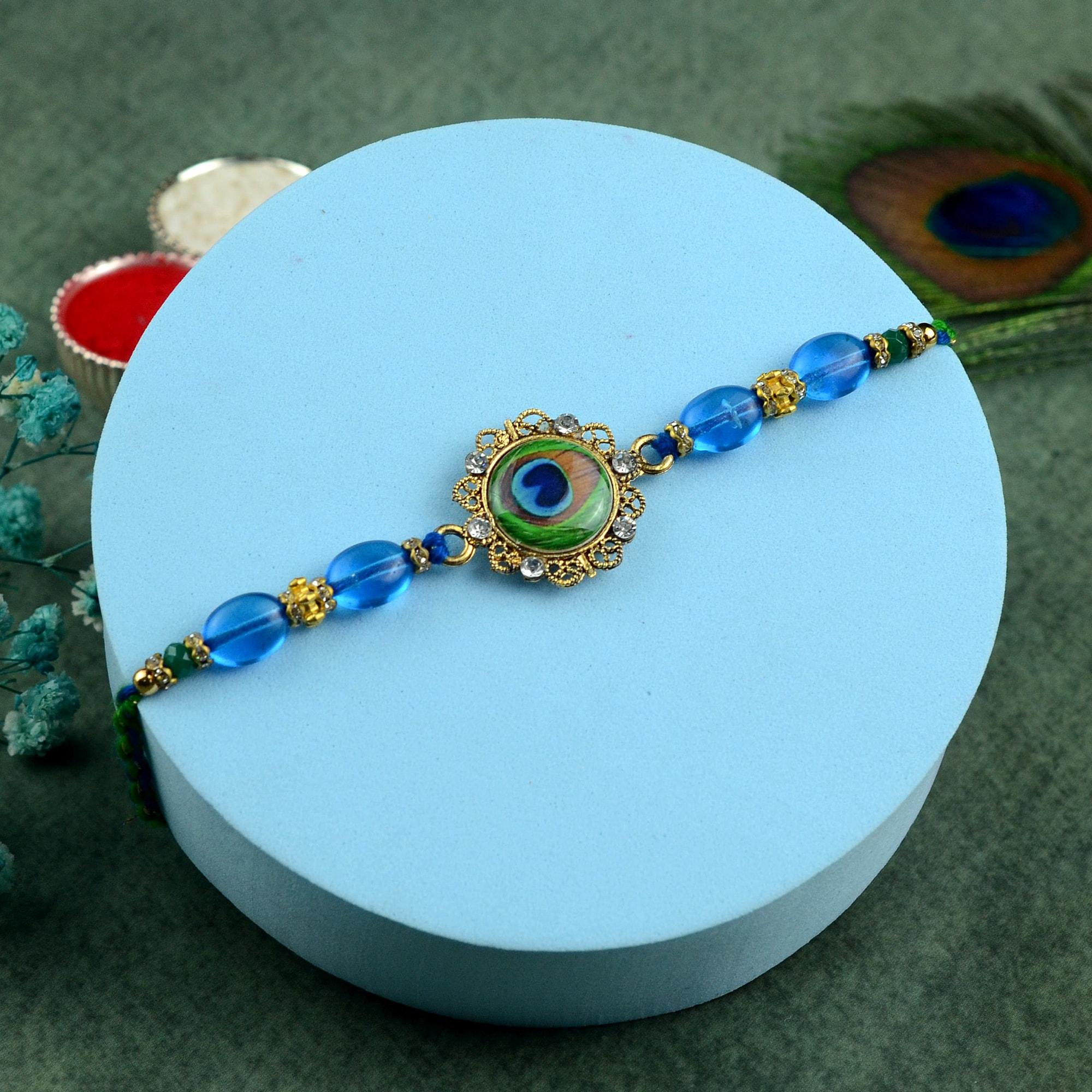 Resn Rakhi Peacock Feather in Resin Rakhi | Peacock Rakhi