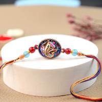 Ganesh in Colorful Oval Rakhi