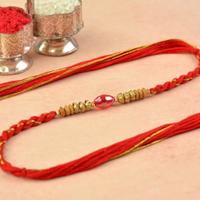 Splendid Spheroid Ruby Dori Rakhi