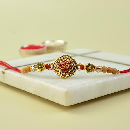 Golden Grill Red Resin Om Rakhi