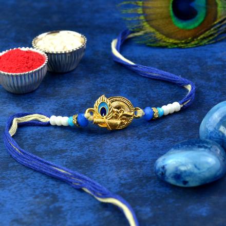 Decked Blue Peacock Feather Rakhi