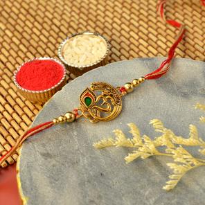 Golden Om with Peacock Feather Rakhi