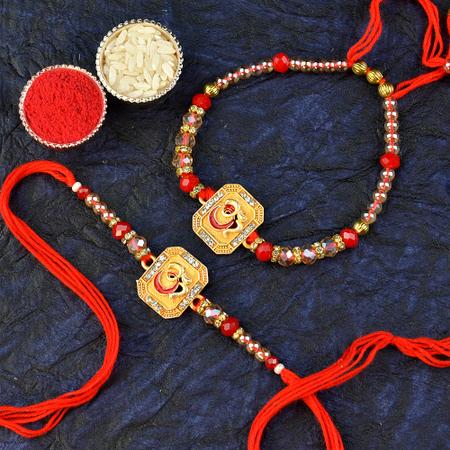 Golden Om Rakhi n Bracelet
