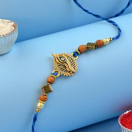 Radiant Peacock Feather Rakhi