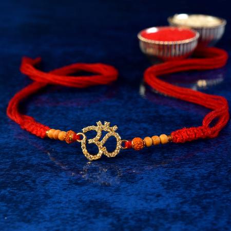 Glittering Gold Stones Om Rakhi