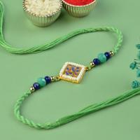 Nine Peacock Eyes Green Rakhi