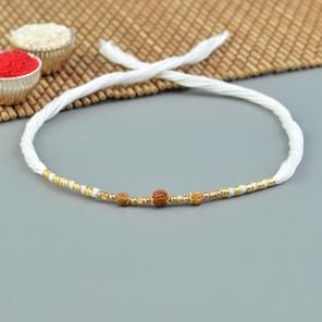 Gold Accentuated Rudraksha Rakhi Gold Accentuated Rudraksha Rakhi