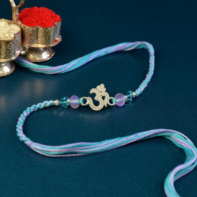 Glittering Om Lilac Blue Rakhi