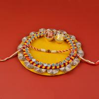 Decorative Round Yellow Thali with Rakhi