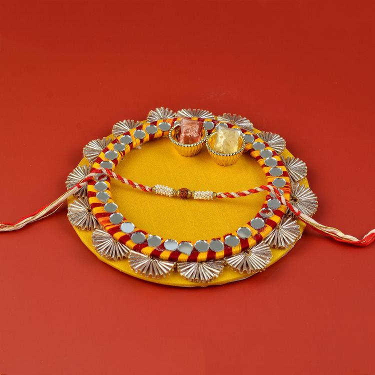 Decorative Round Yellow Thali with Rakhi