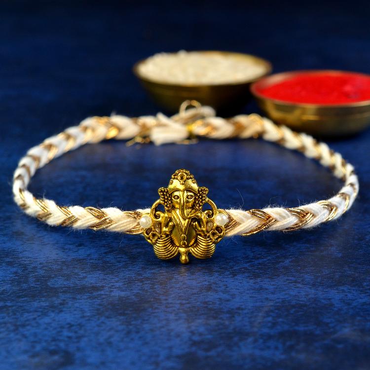 Ganesh - Golden Standing White Rakhi