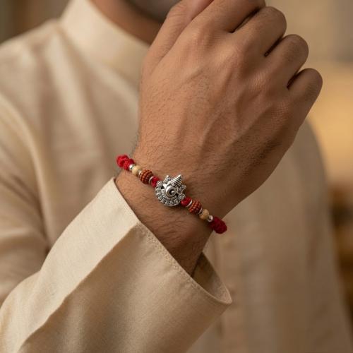 Glowing White Ganesh Rakhi