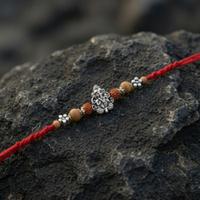 Intricate White Metal Ganesh Rakhi