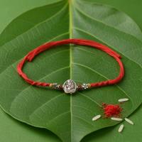 Intricate Ganesh with Flute Rakhi