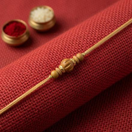 Carved Sandalwood Bead Rakhi